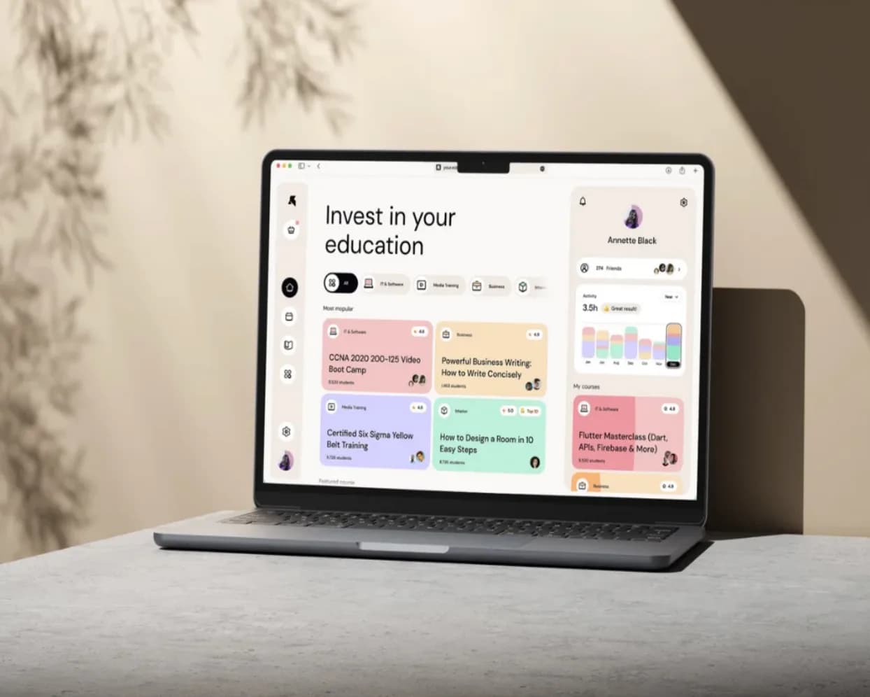 A laptop on a desk showing an education platform
